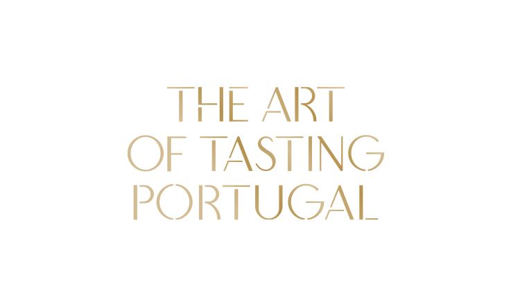 Logotipo da plataforma "The Art of Tasting Portugal", formado pela inscrição do nome da marca em letras maiúsculas douradas.