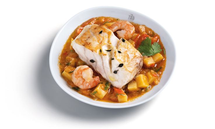 Photograph of a white plate with grilled grouper with shrimp stew and sweet potato.