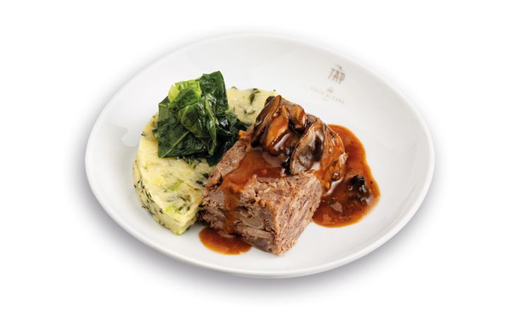 Photo of a white dish showing the TAP logo, with Beef Sirloin, Mashed Corn and Cabbage with Madeira Sugarcane Molasses.